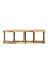 Detailed shot of a foldable dark wooden stand for ten bottles of wine. The folded wine bottle stand made out of dark wood is isolated on the white background.