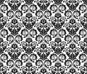 Floral pattern. Vintage wallpaper in the Baroque style. Seamless vector background. White and black ornament for fabric, wallpaper, packaging. Ornate Damask flower ornament