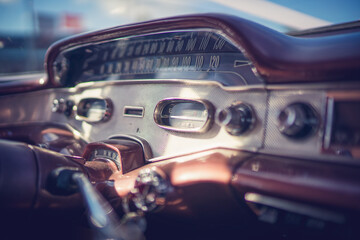 Obraz na płótnie Canvas Close up of 1955 Chevrolet interior dashboard with radio knobs and dials. 