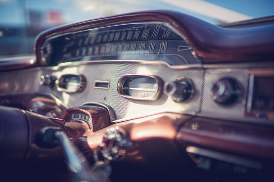 Close up of 1955 Chevrolet interior dashboard with radio knobs and dials. 
