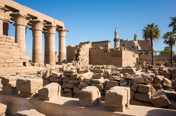 Luxor temple open air museum exposition of stones of ancient ruins next to giant columns
