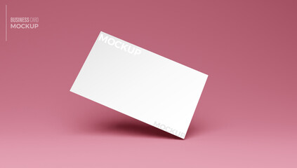 Obraz na płótnie Canvas Mockup of blank business card at pink isolated background.