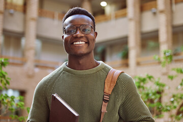 University student, black man and portrait at campus for education, learning and studying in Atlanta. Happy young male college student with motivation for knowledge, scholarship opportunity and goals - obrazy, fototapety, plakaty