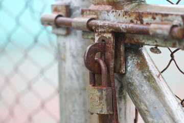 A rusty padlock for a safety tennis court can create a unique and eye-catching image. The contrast of the rusty padlock against the bright colors of the court can create a stunning visual.
