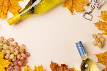 White wine bottles and autumn leaves