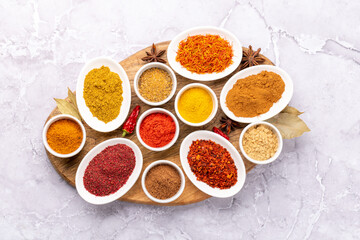 Obraz na płótnie Canvas Various dried spices in small bowls