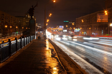 Fototapeta na wymiar Light traces of traffic at Victory bridge, Moscow on winter night