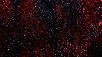 Glitter texture. Abstract background. Fantasy night sky. Defocused shiny metallic red black color...