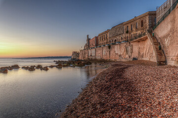 The breathtaking scenery of the Ortigia seafront in Syracuse Sicily in  the sunrise of a new day
