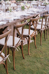 outdoor event, white chairs and tables placed outside