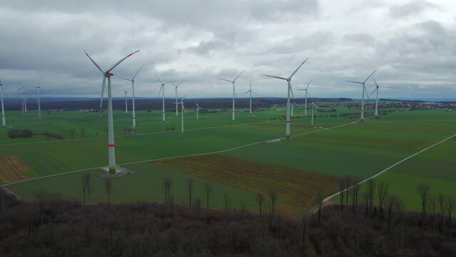 Cloudy Sky and Sustainable Energy: Wind Turbines Generating Power on a Beautiful Field in Bad W&uuml;nnenberg, Paderborn,North Rhine-Westphalia, Germany