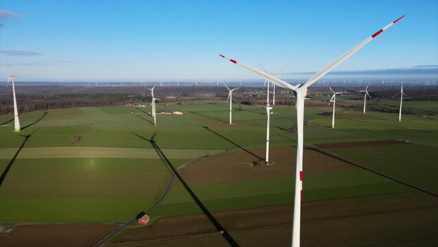 Sustainable Power in Sauerland: Wind Turbines Generating Clean Energy on a Beautiful Field on a Sunny Day in Brilon