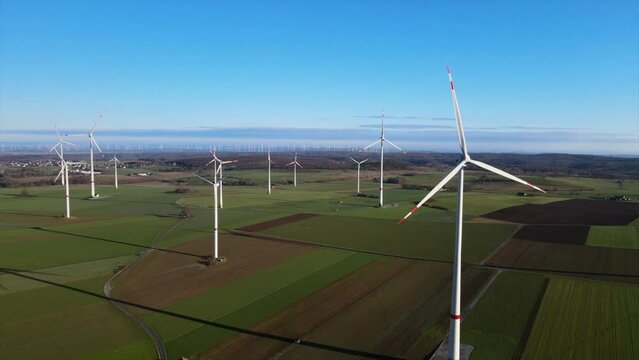 Harnessing the Power of the Wind: Aerial View of Wind Turbines Generating Renewable Energy on a Sunny Day in Brilon, Sauerland, Germany