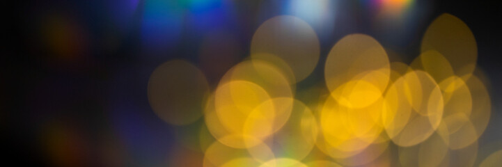 Beautiful abstract background with golden bokeh for Festive, Christmas and party design web banner.