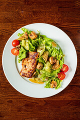 pork with vegetables on wooden table