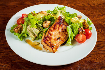 pork with vegetables on wooden table