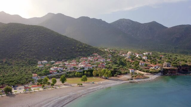 4k drone forward video (Ultra High Definition) of Paralia  village. Colorful outdoor scene of Peloponnese peninsula, Greece, Europe. Photography of Mediterranean seascape.
