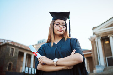 Graduation, education and portrait of woman at university, college and academic campus with diploma...