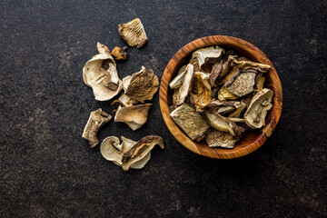 Sliced dried mushrooms in bowl. Top view.