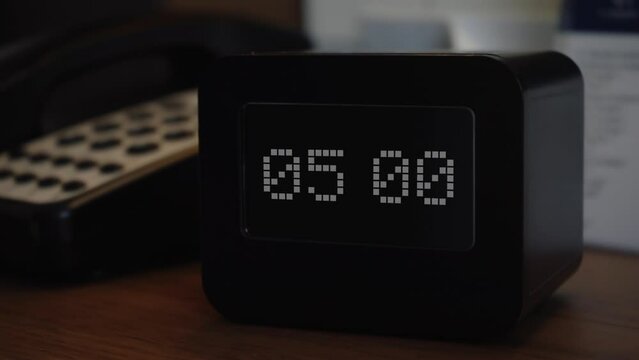 The clock or alarm clock shows the time 05 o'clock. Time display on the electronic scoreboard. Wake up or getting up for work, study or in connection with an important