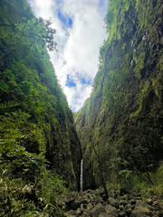 Fototapeta na wymiar beautiful waterfall seen between the green mountains