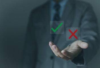 Businessman hand showing right and wrong symbol Deciding yes or no