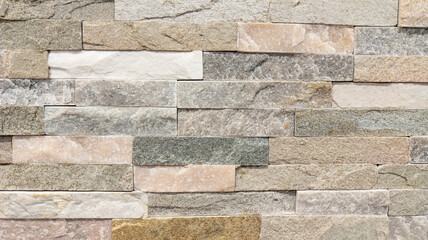 square stone grey wall background of house brick brown horizontal stones wallpaper