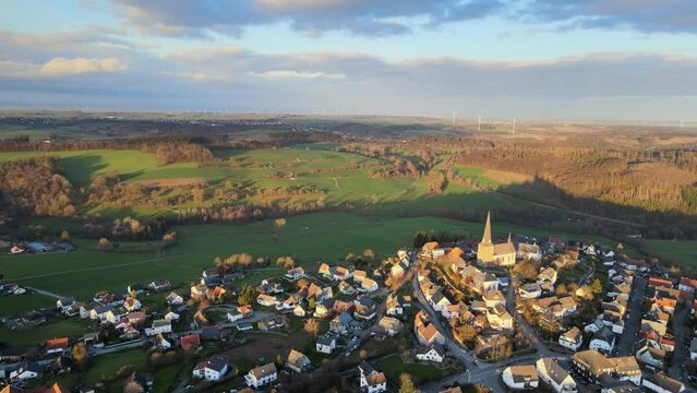 Kallenhardt in the Glowing Light of Winter Sunset: Drone Shot of the Town in the Sauerland, Germany