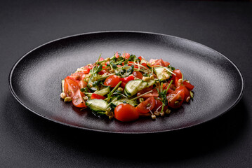 Delicious juicy fresh salad of tomatoes, peppers, cucumber, microgreens and sprouted mung bean