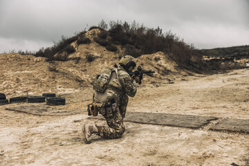 Fototapeta premium Sniper with rifle on a position