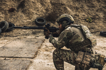 Sniper with rifle on a position