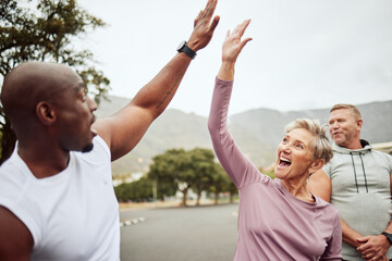 Fitness, high five and diversity friends or people with support, accountability and teamwork in nature training, exercise or workout. Wellness, community and senior with target, success or goal sign
