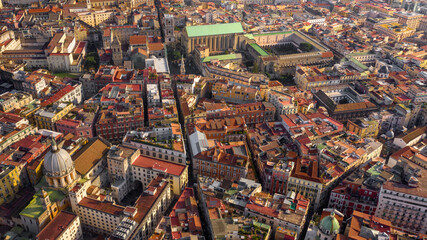 Fototapeta premium Aerial view of the Basilica of Santa Chiara, a religious complex in Naples, Italy, which includes a church, a monastery, tombs and an archaeological museum. The building overlooks Via Spaccanapoli.