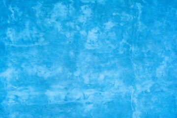 Concrete wall painted blue. Background with the old wall.
