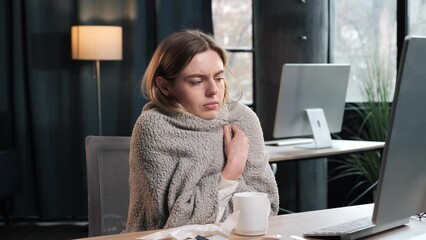 Sick upset young woman blowing running nose got flu while working from office, typing on keyboard of pc laptop, caught cold sneezing having health problem flue, suffers due to low temperature indoor. - Powered by Adobe