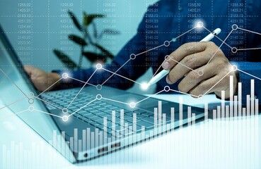 Digital online marketing businessman using tablet and analyzing sales data graph growth on modern interface icon in strategy analysis and content development related global network connection. 