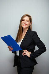 Smiling school teacher woman or adult student with book. Isolated business lady portrait with black suit.