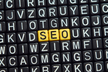 SEO - word concept on cubes, text