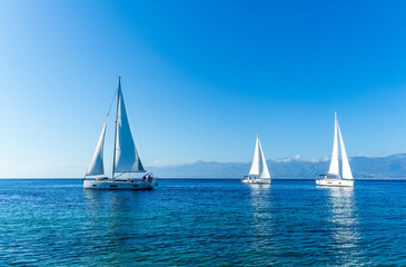 sailing yacht boats with white sails in blue sea , seascape of beautiful ships in sea gulf with...