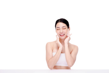 Attractive beauty young asian woman clean skin with cotton pad removing make up on white background. © edkoumi