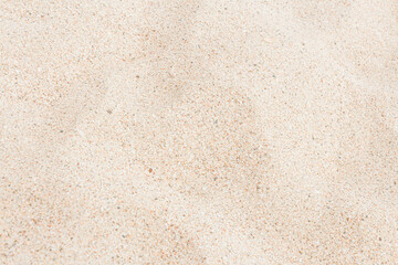 Natural white sandy beach background and texture, soft focus.