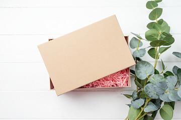 Shredded pink paper packing material texture in a craft box, mockup design