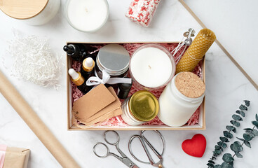Gift box with candle making tools, candle, soy wax, wicks and aroma oil bottles