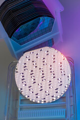 patterned silicon wafers in a universal pod. Electronic circuit designs have been built onto the...