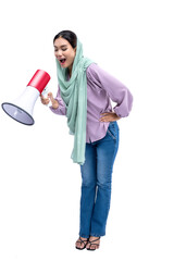 Asian Muslim woman in a headscarf yelling on a megaphone