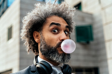 Young entrepreneur chewing fruit bubble gum