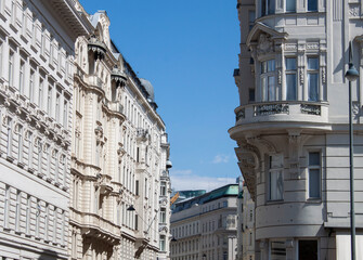 Facade of historical buildings in the old town of Vienna, Austria, Central Europe. Ornaments and patterns of white houses, architectural background. Exterior view of luxury and elegant neighborhood.