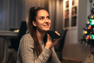 Girl using a smart phone voice recognition