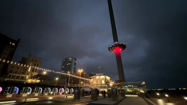 Brighton coastal city at night with i360 tourist attraction in England