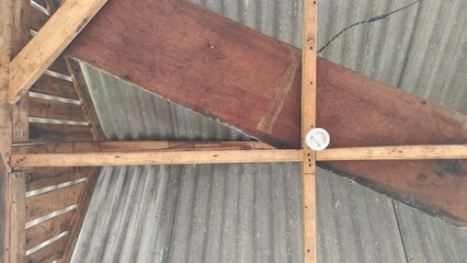 unfinished ceiling work in the garage during sunny day